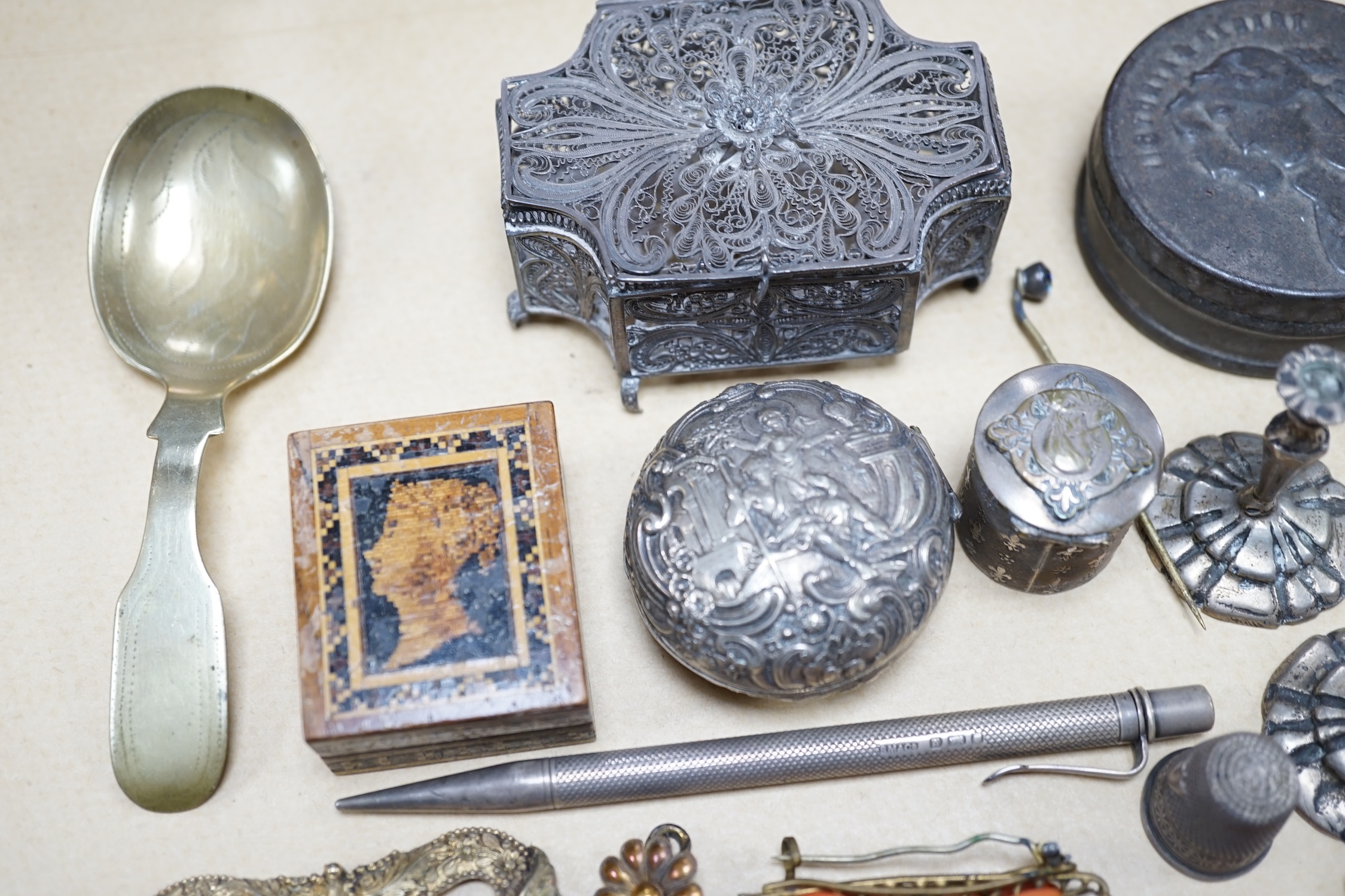 Objects of vertu and jewellery to include a carved coral stick, a pair of miniature candlesticks, a gilt metal shoe buckle, a Scottish hardstone anchor brooch and a Tunbridge ware stamp case. Condition - varies